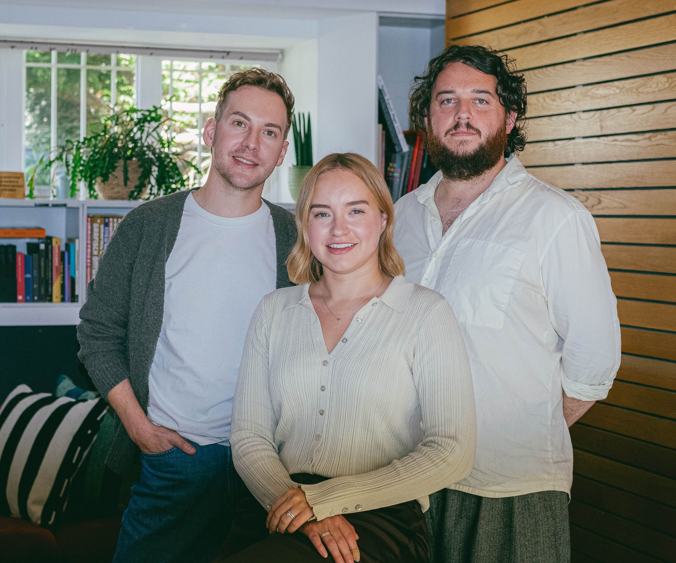 Joss Ward, Em Blalock and Erik Winterburn stood together in the studio