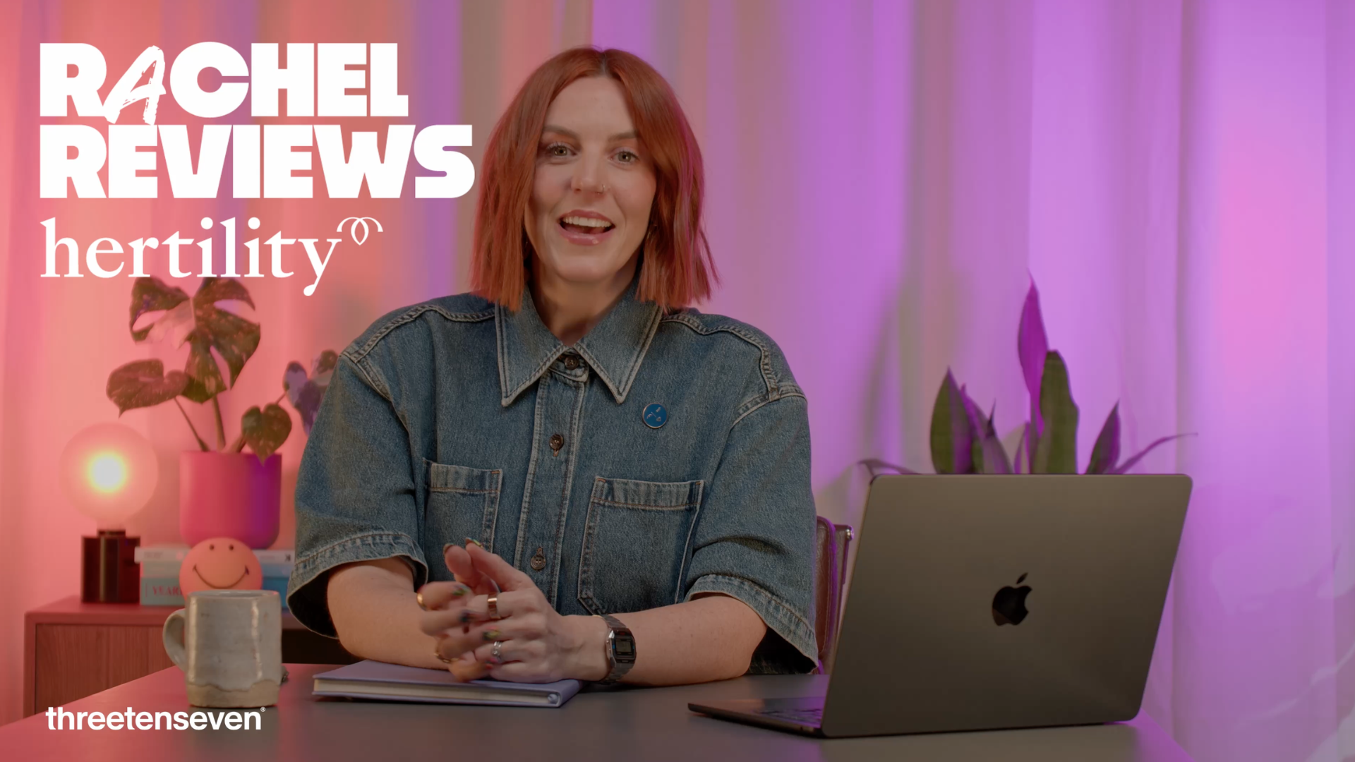 Rachel, sat at a desk with the text 'Rachel Reviews: Hertility' in the top left, and the 'ThreeTenSeven' logo in the bottom left