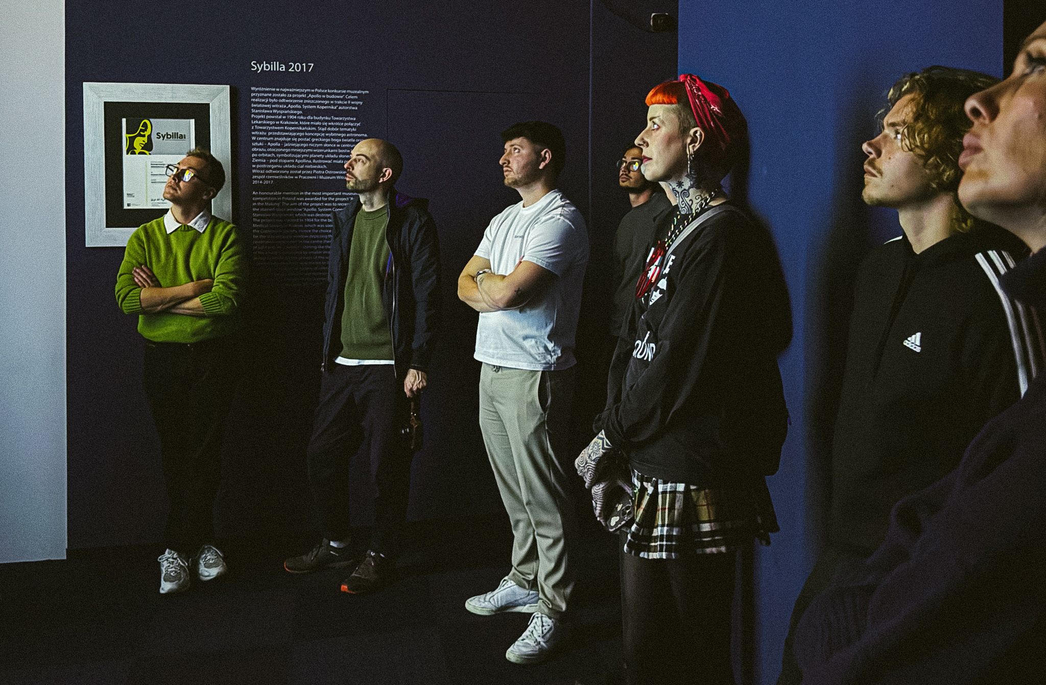Team looking in awe at the stained glass exhibition