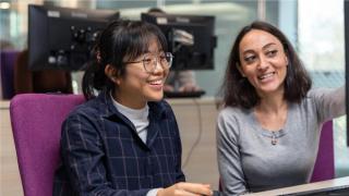 Photo of student working with tutor