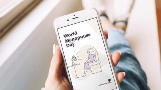 Illustration on mobile phone of woman with fan blowing at her