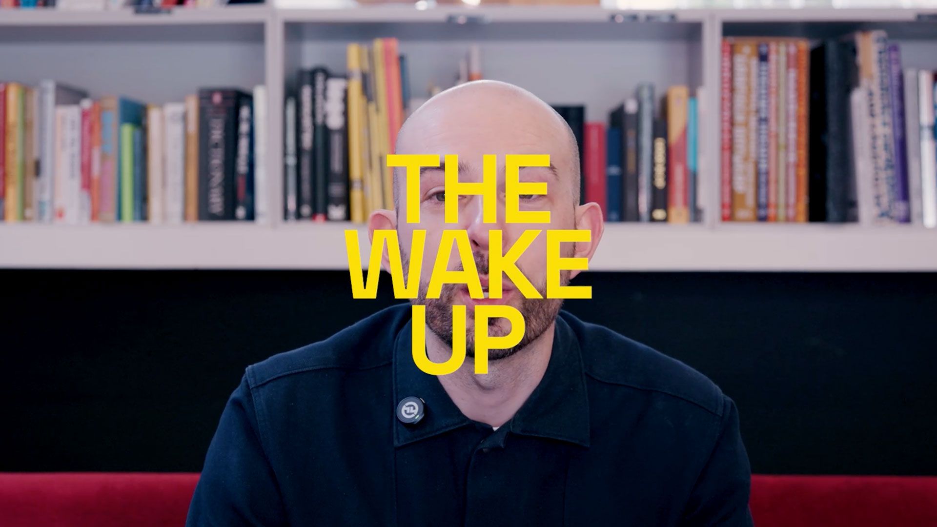 The Wake Up text over an image of Chris sat in the studio