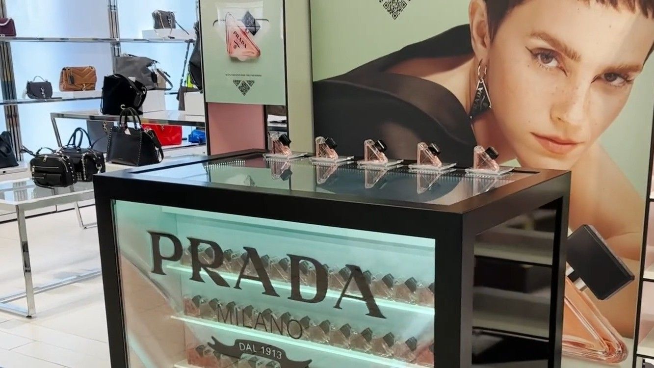 Transparent LCD counter over fragrance bottles