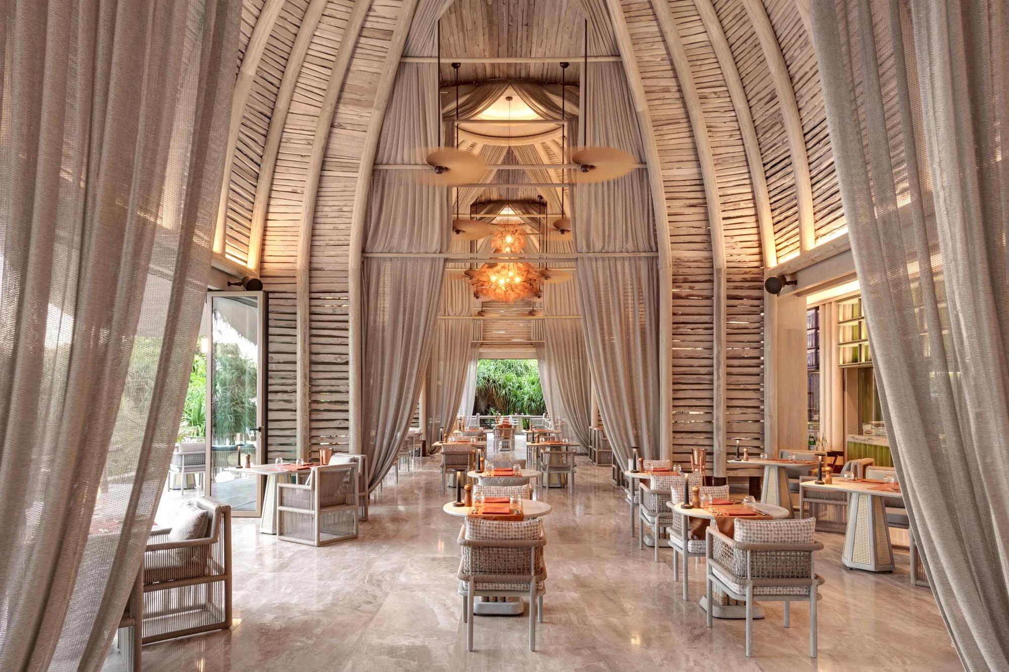 The interior dining room at FLOW, Joali Being — the Wine Cellar has no dedicated published photo, so this interior view of its host restaurant stands in here