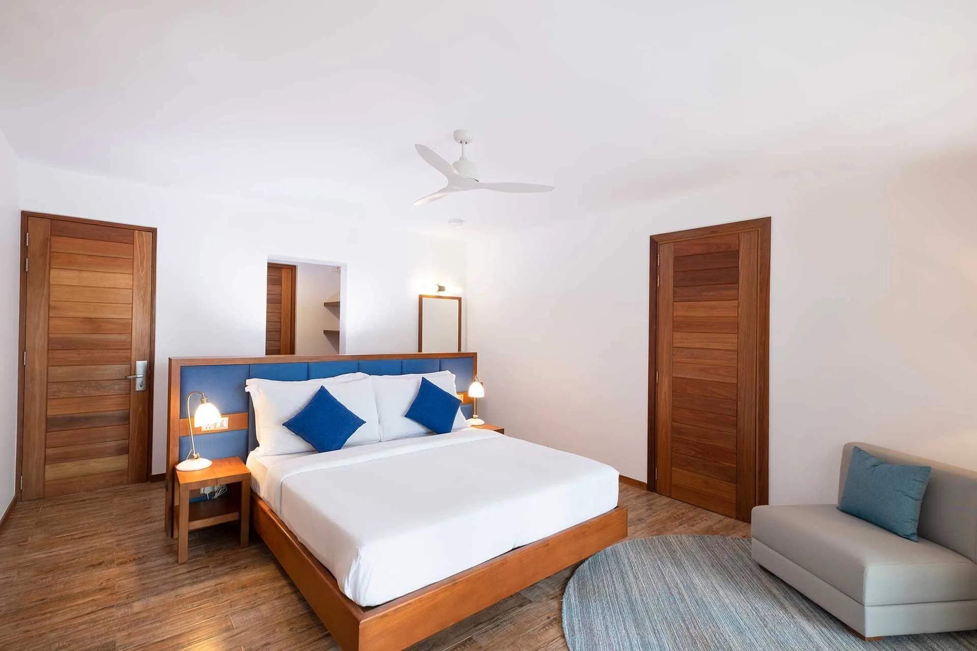The bedroom of a Sunset Beach Suite at Ifuru Island Maldives