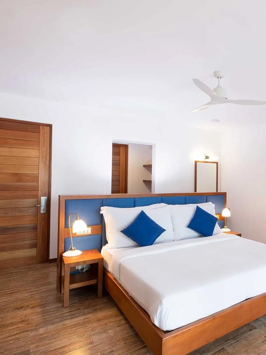 The bedroom of a Sunset Beach Suite at Ifuru Island Maldives