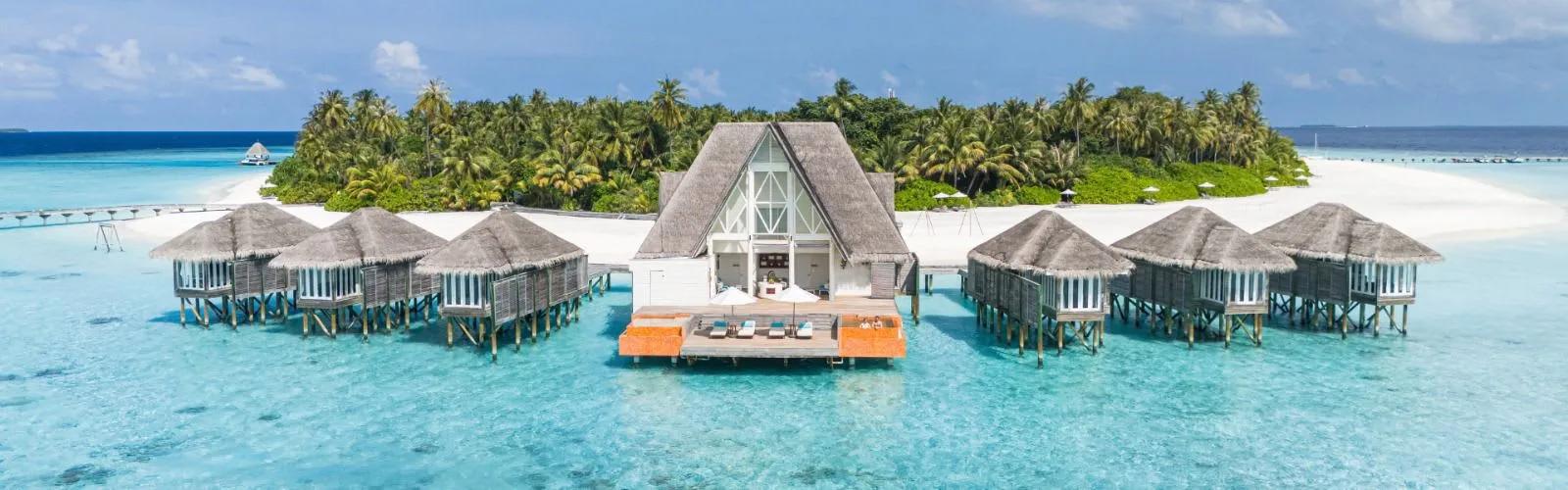 Anantara Spa's overwater treatment pavilion at Anantara Kihavah, reached by a jetty over the lagoon
