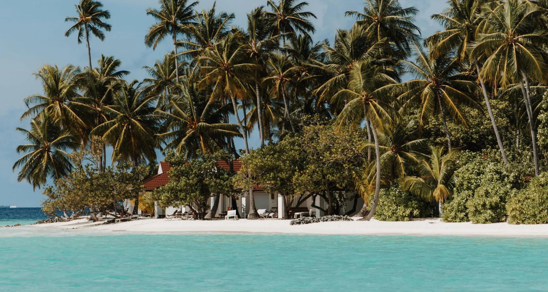 Exterior of the Lagoon Villas at Diamonds Athuruga, set along the calm, shallow lagoon