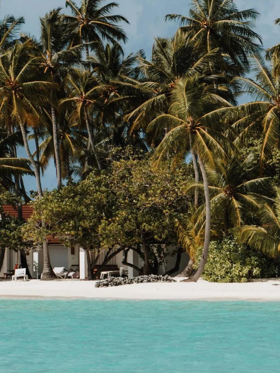 Exterior of the Lagoon Villas at Diamonds Athuruga, set along the calm, shallow lagoon