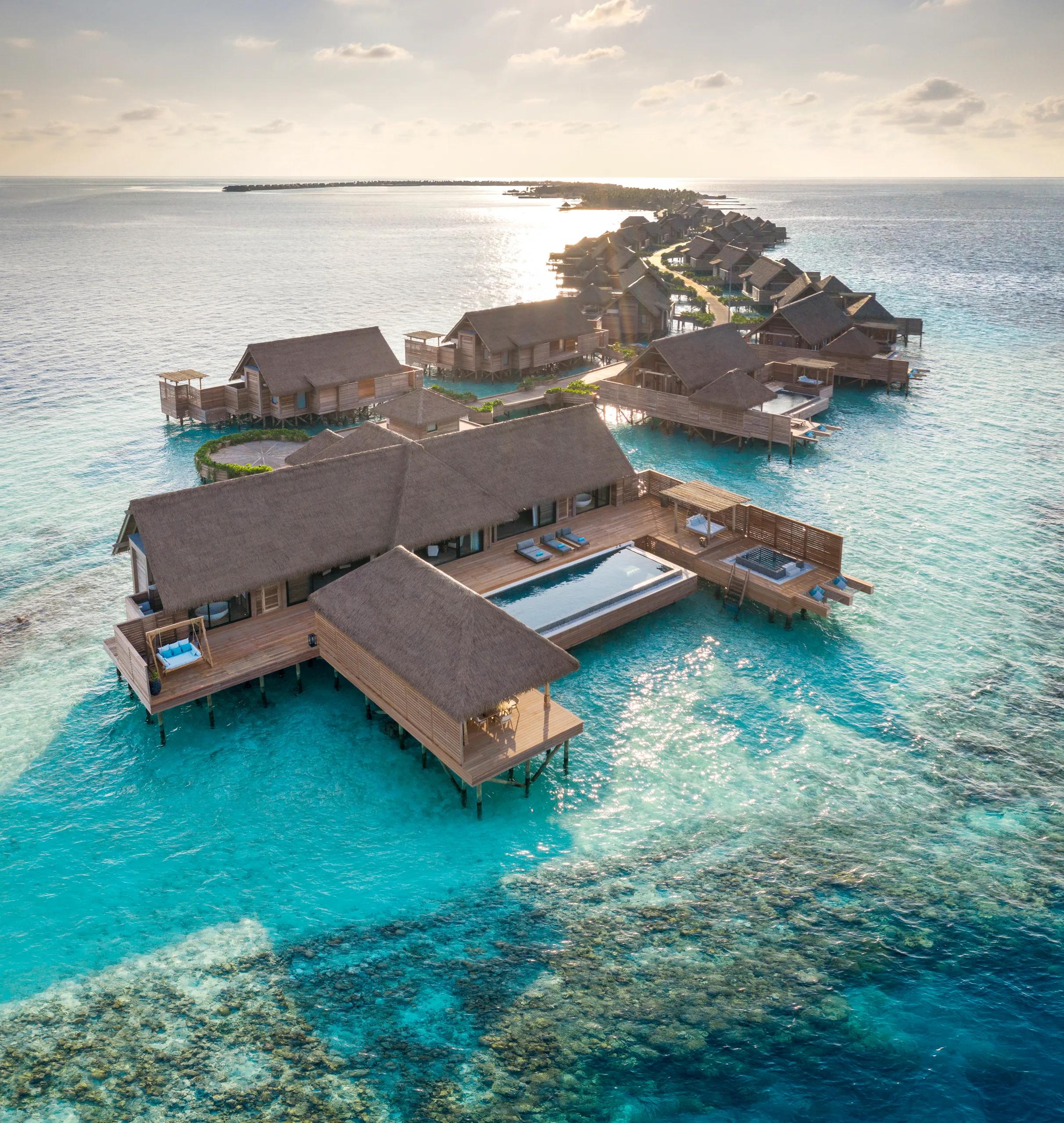 The exterior deck and pool of the Two Bedroom Overwater Villa at Waldorf Astoria Maldives Ithaafushi, suspended above the lagoon