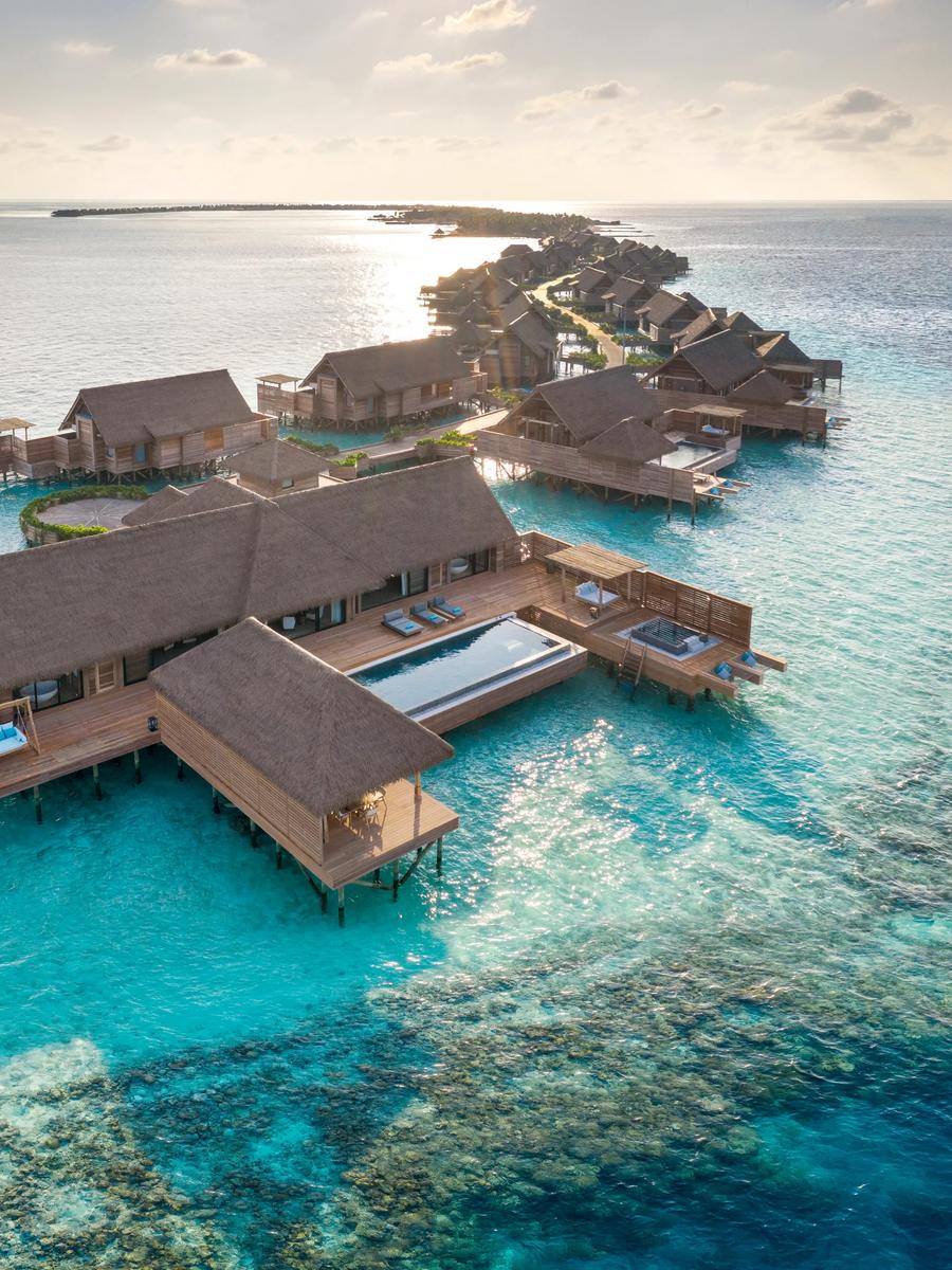 The exterior deck and pool of the Two Bedroom Overwater Villa at Waldorf Astoria Maldives Ithaafushi, suspended above the lagoon