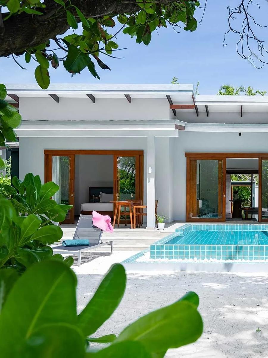 The exterior and private pool of a Sunset Two Bedroom Villa with Pool at Ifuru Island Maldives