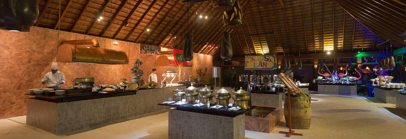 Funama Restaurant's open-air buffet room, set on sand, with the Kids Island counter visible