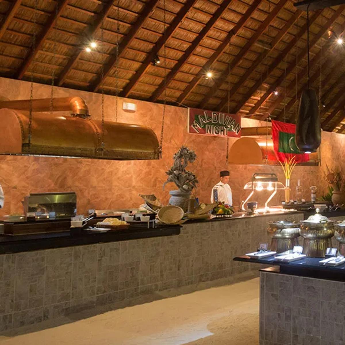 Funama Restaurant's open-air buffet room, set on sand, with the Kids Island counter visible
