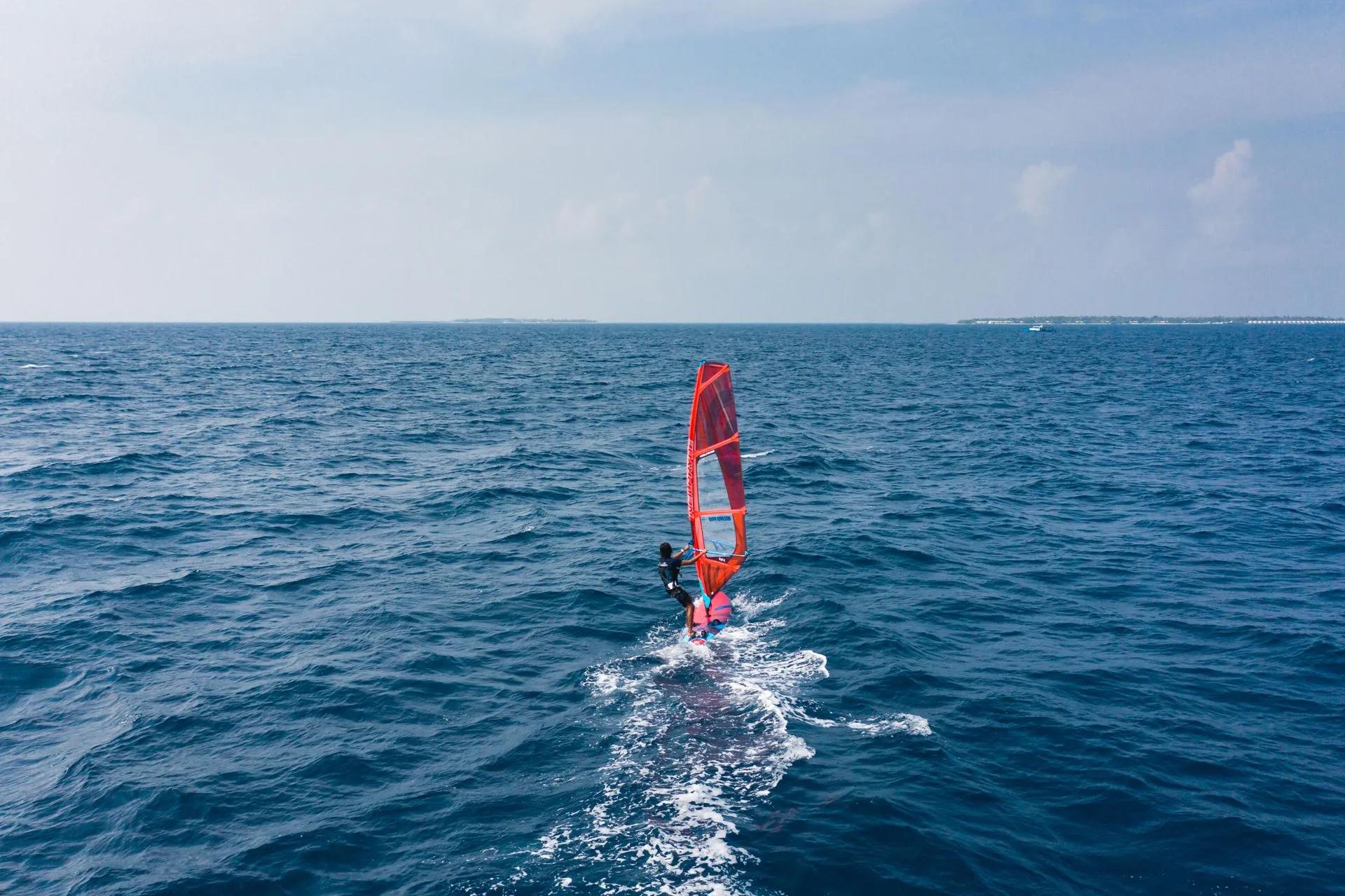 A windsurfer sailing near Heritance Aarah's lagoon