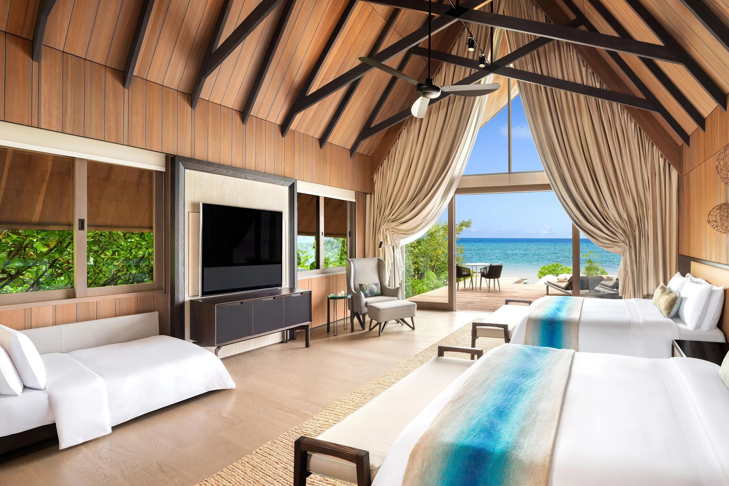 A bedroom within the Caroline Astor Estate, the resort's three-bedroom beachfront estate