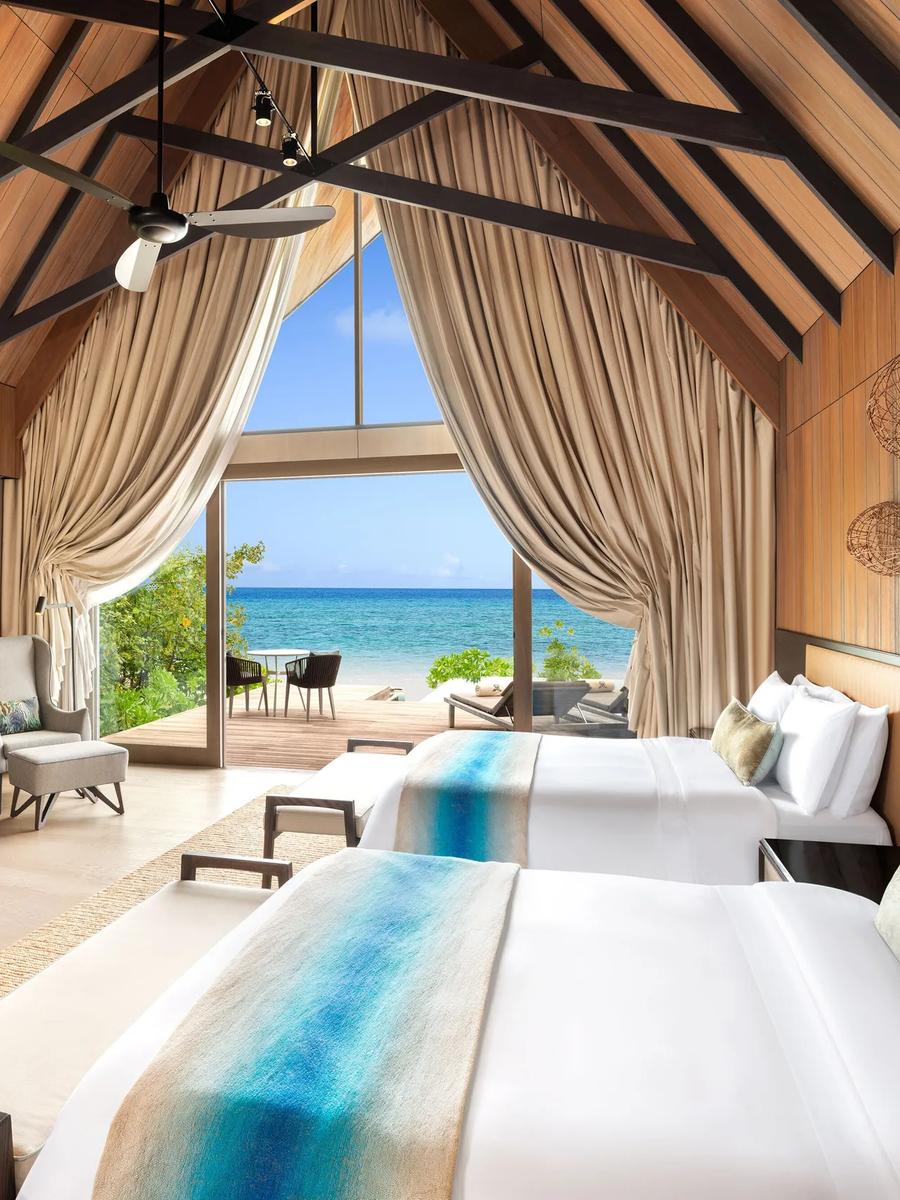 A bedroom within the Caroline Astor Estate, the resort's three-bedroom beachfront estate