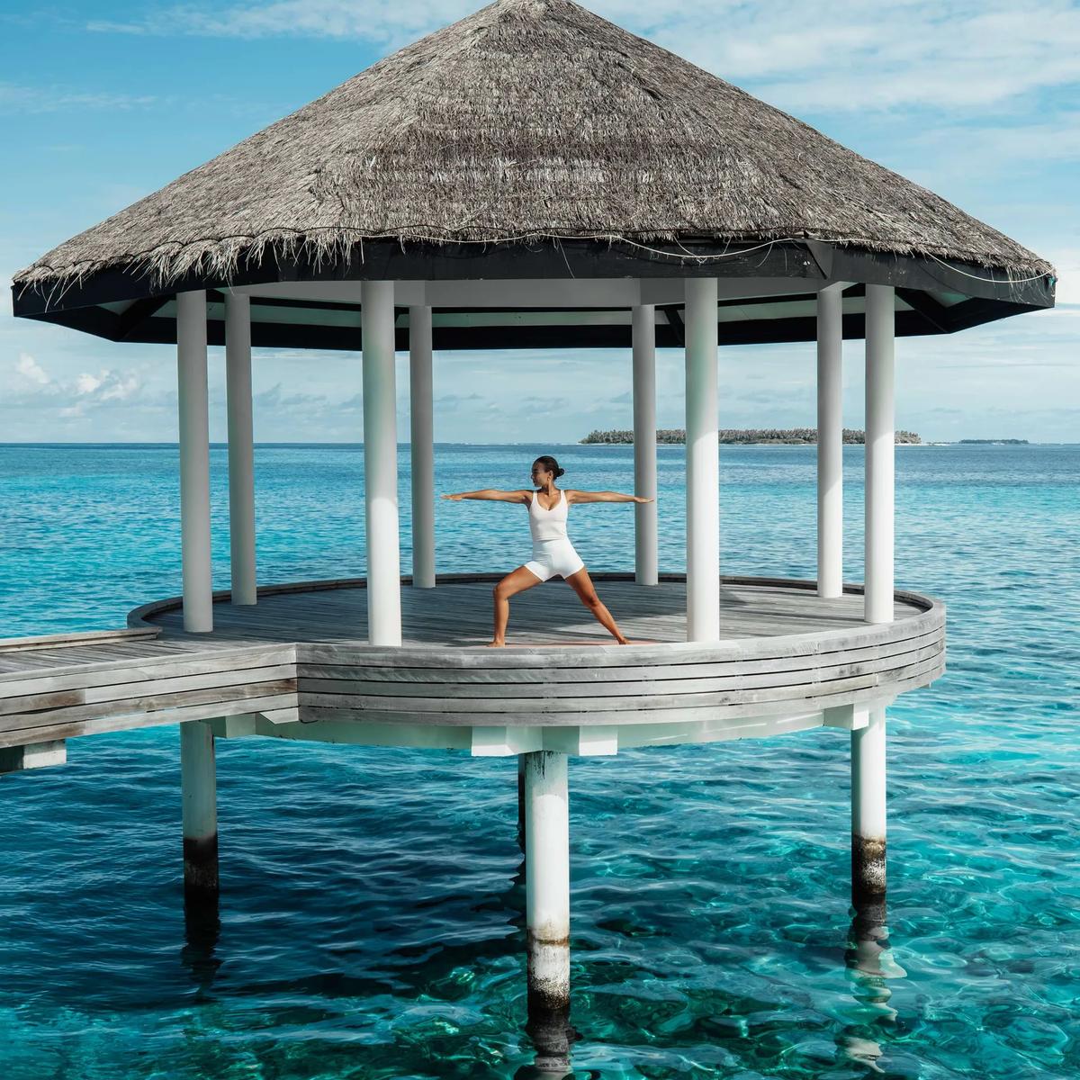 An overwater pavilion above calm lagoon water at Radisson Blu Resort Maldives; a dedicated photograph of Floating Indulgences was not available in this research pool, so this overwater setting stands in as a reference