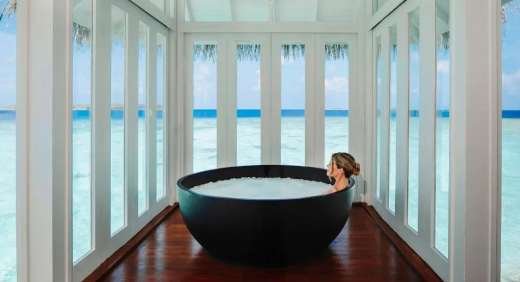Interior of an overwater treatment suite at Anantara Spa, Anantara Kihavah Maldives Villas