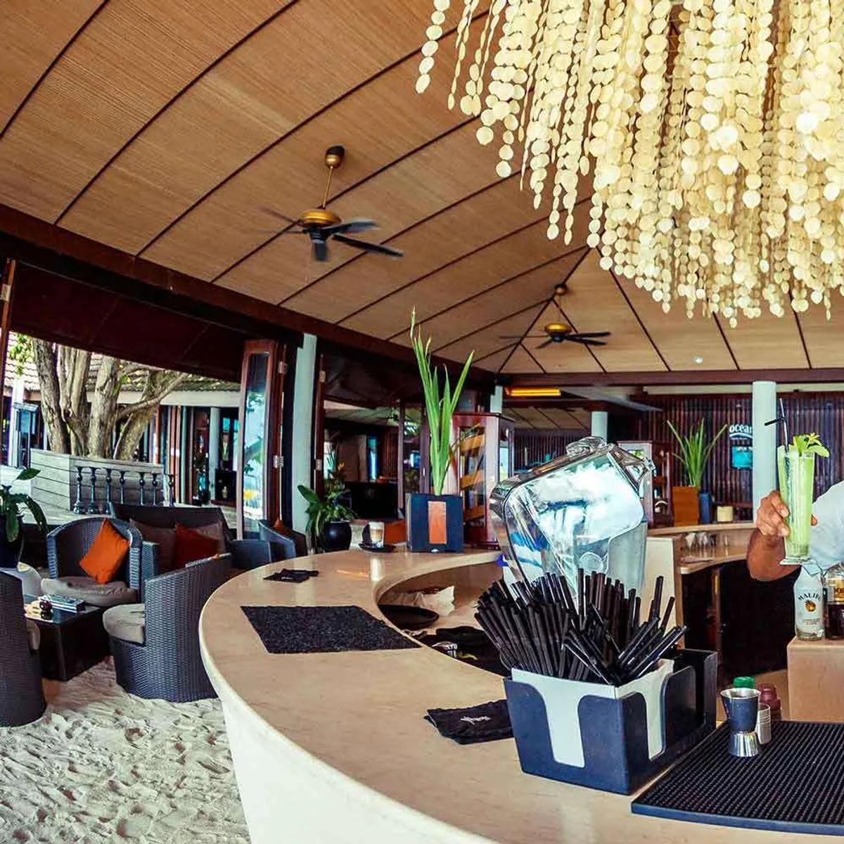 The outdoor terrace at The Spirit Bar, Lily Beach Resort & Spa