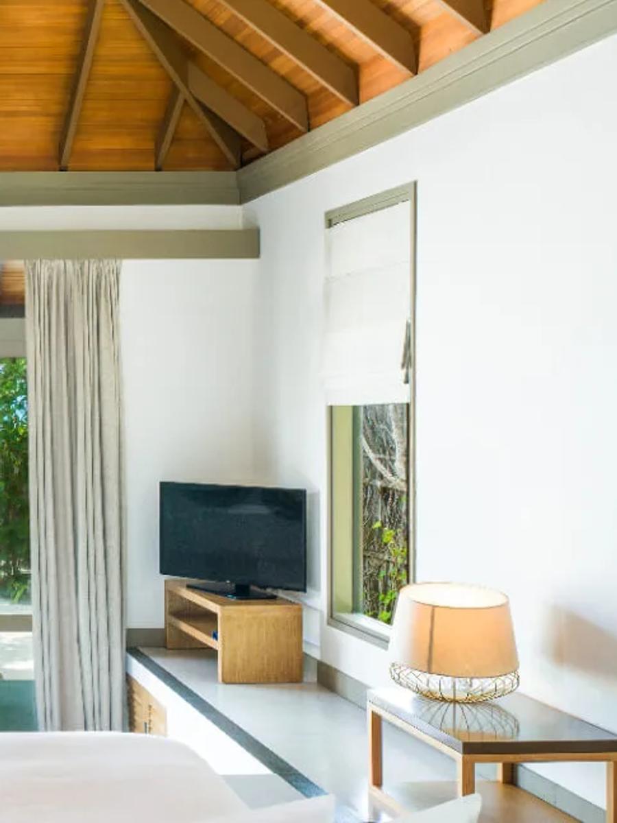 A Beach Villa with Private Pool at JA Manafaru, set in a garden at the water's edge