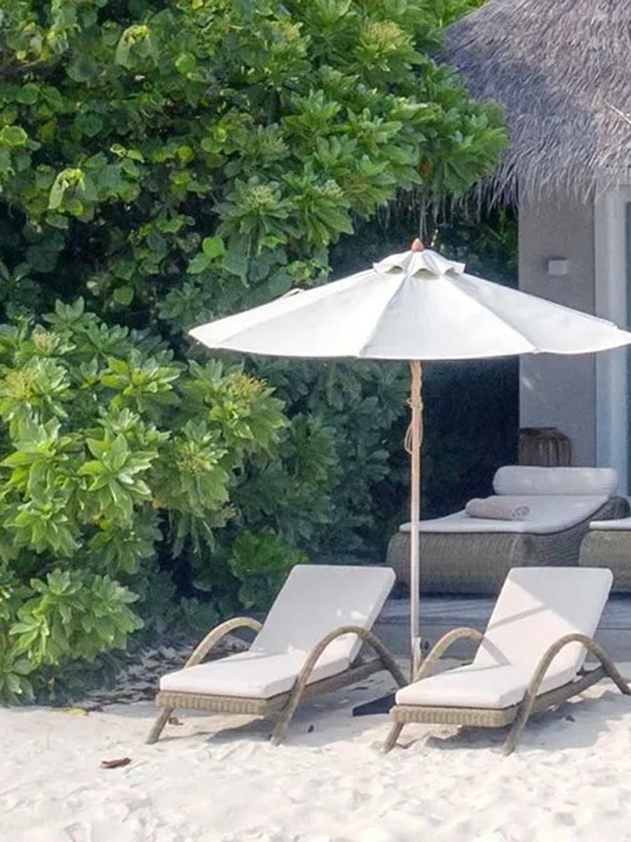 A Deluxe Beach Suite with Pool's twin thatched pavilions set either side of a private plunge pool, beachfront at Baglioni Maldives