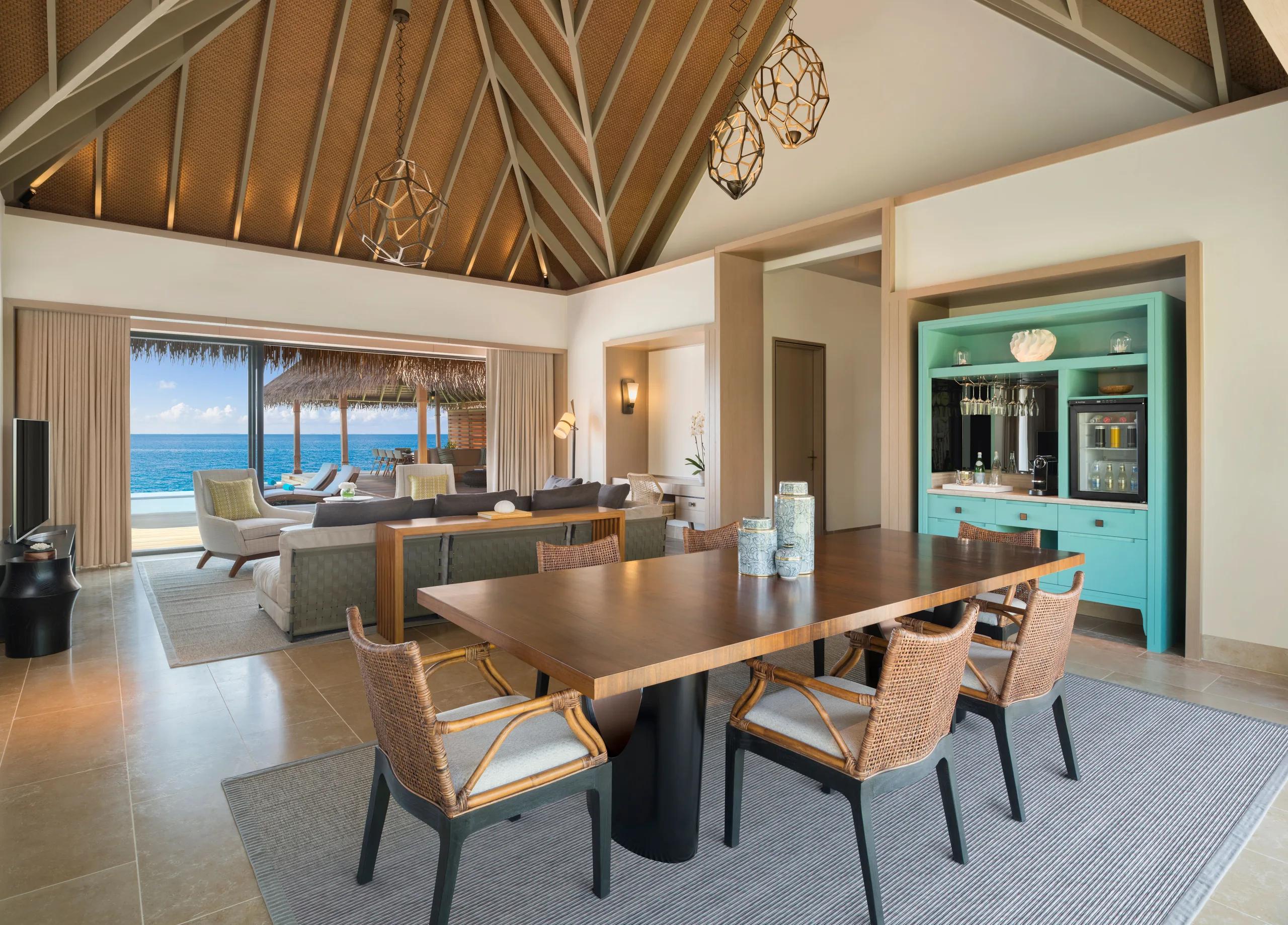 The bedroom of a Two Bedroom Reef Villa at Waldorf Astoria Maldives Ithaafushi, opening toward the lagoon