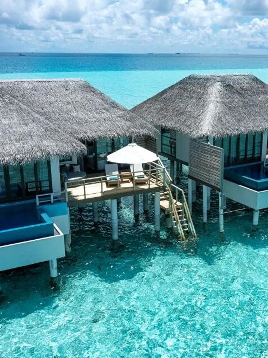 An aerial view of the Water Villas with Pool, each with its own plunge pool over the lagoon