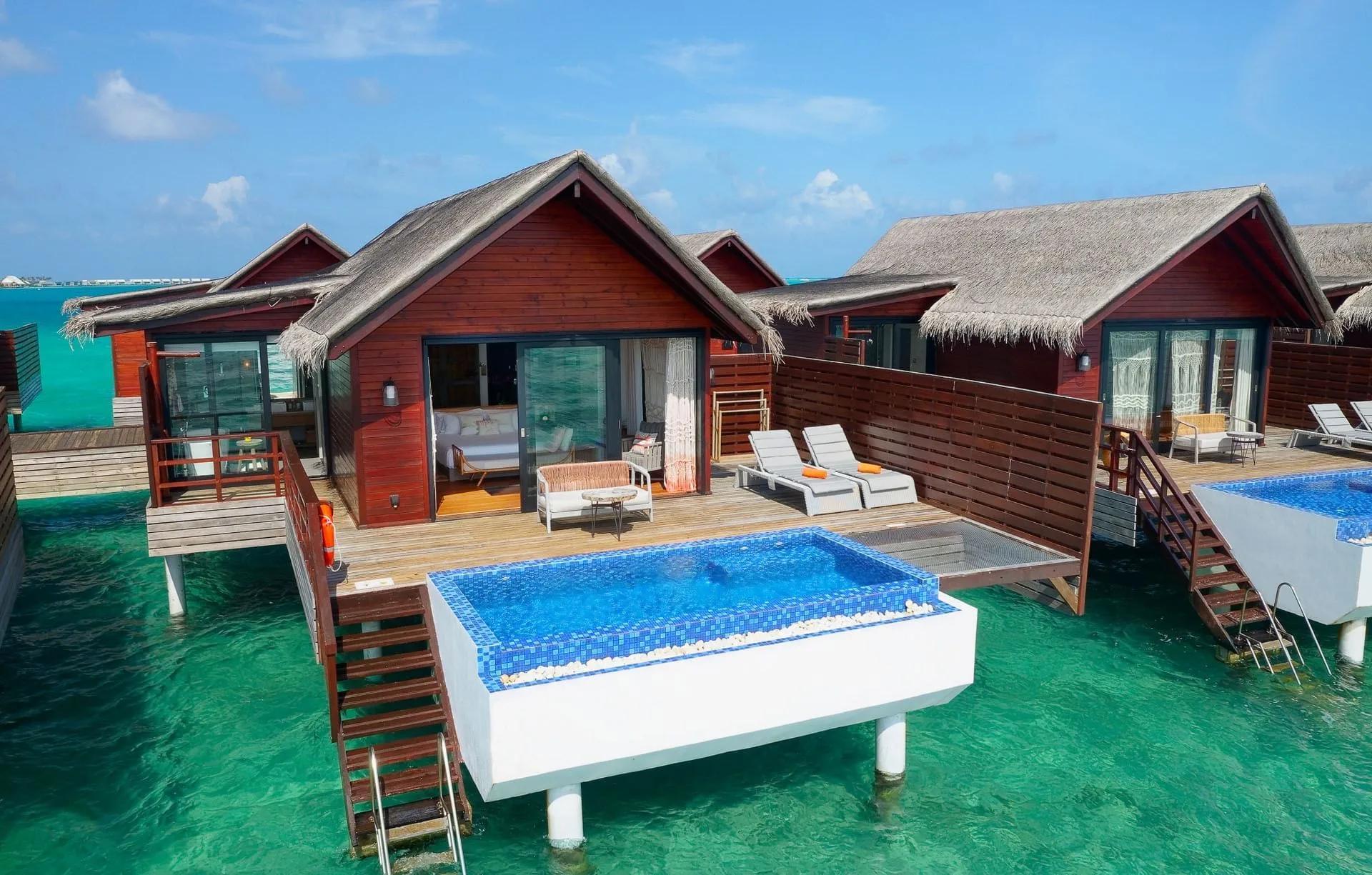 The overwater deck and private plunge pool of a Pool Water Villa