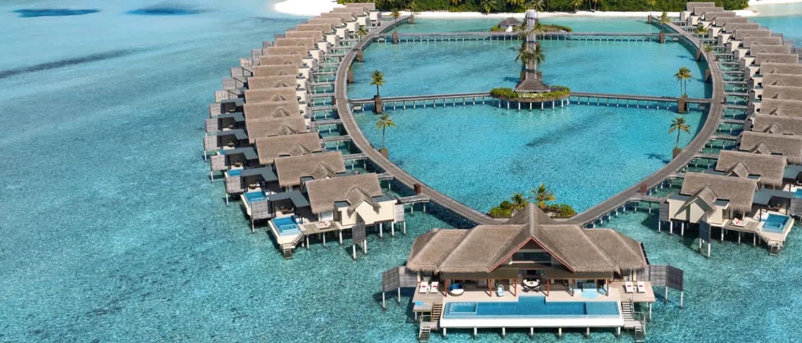 Aerial view of the overwater pool villas alongside Chill island at Niyama Private Islands