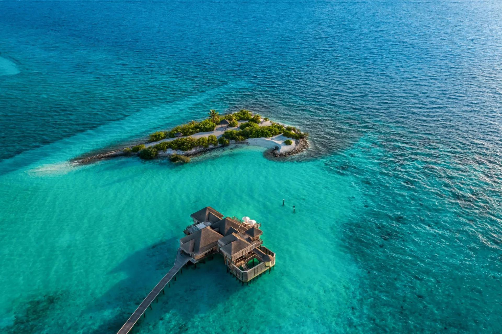 Aerial view of a Family Villa (Sunset Two Bedroom Villa) at Gili Lankanfushi, with its extended family dining deck