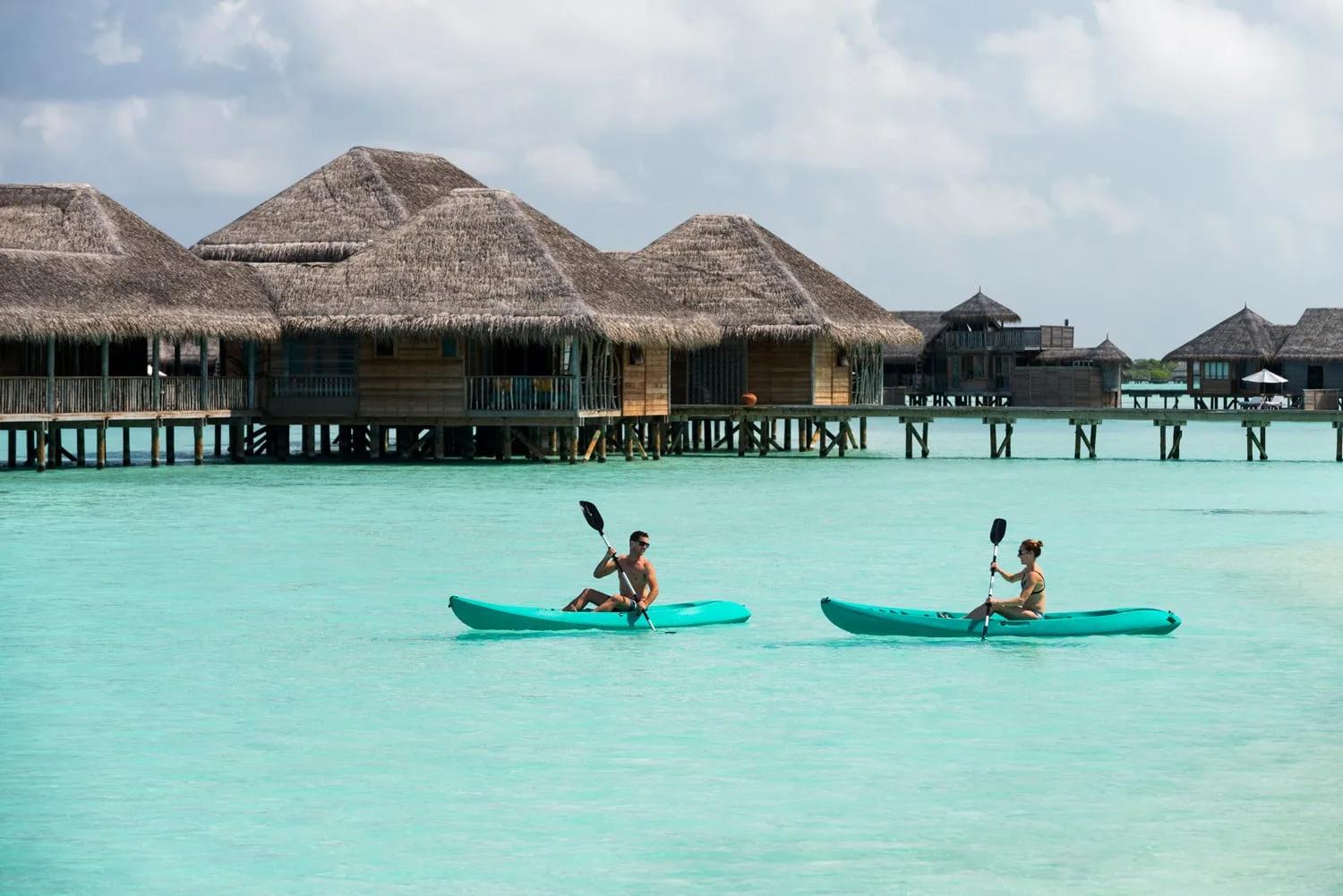 A guest kayaking out from Gili Lankanfushi's villa jetties