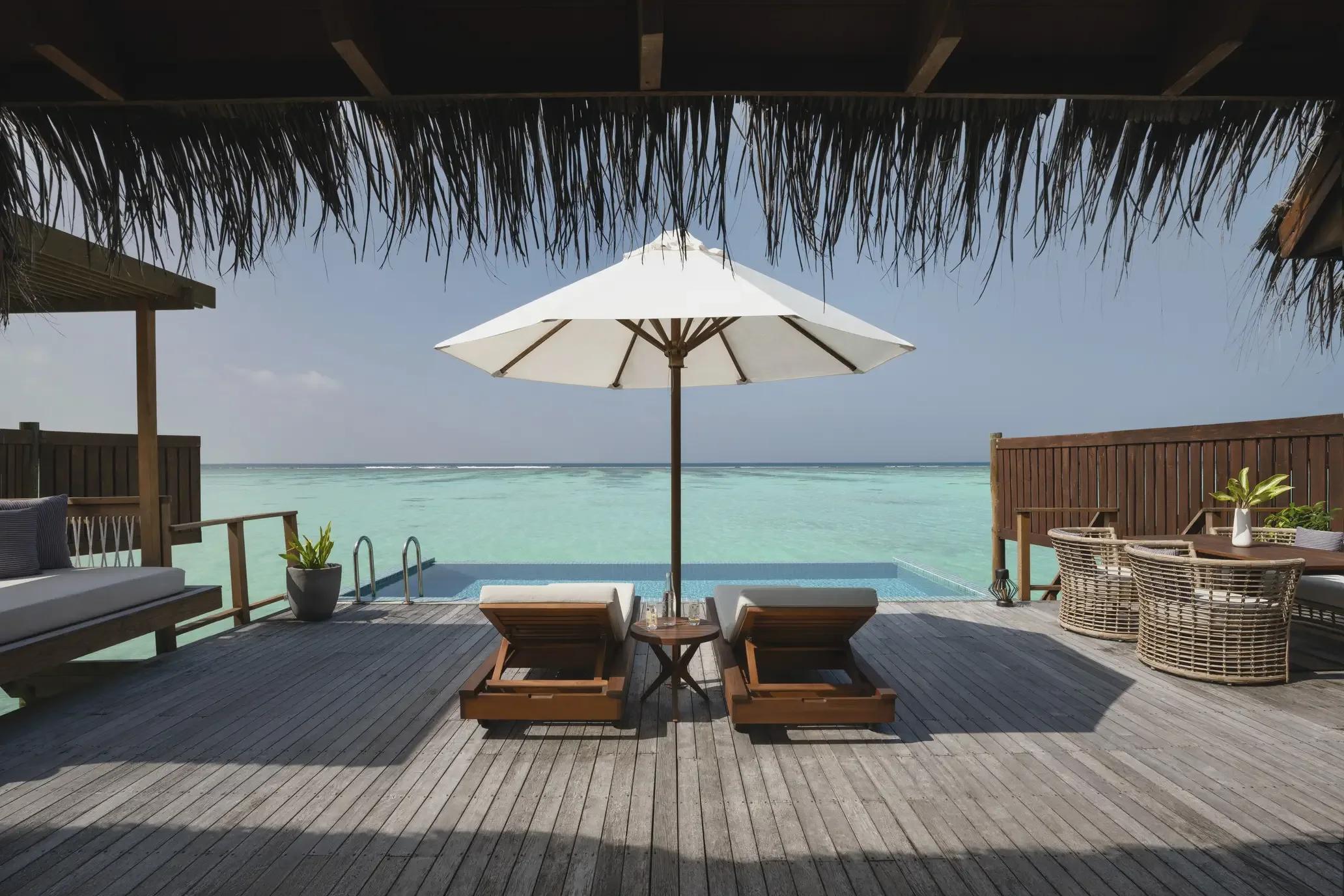 The infinity-edge pool and deck of a Premier Water Villa with Pool at Conrad Maldives Rangali