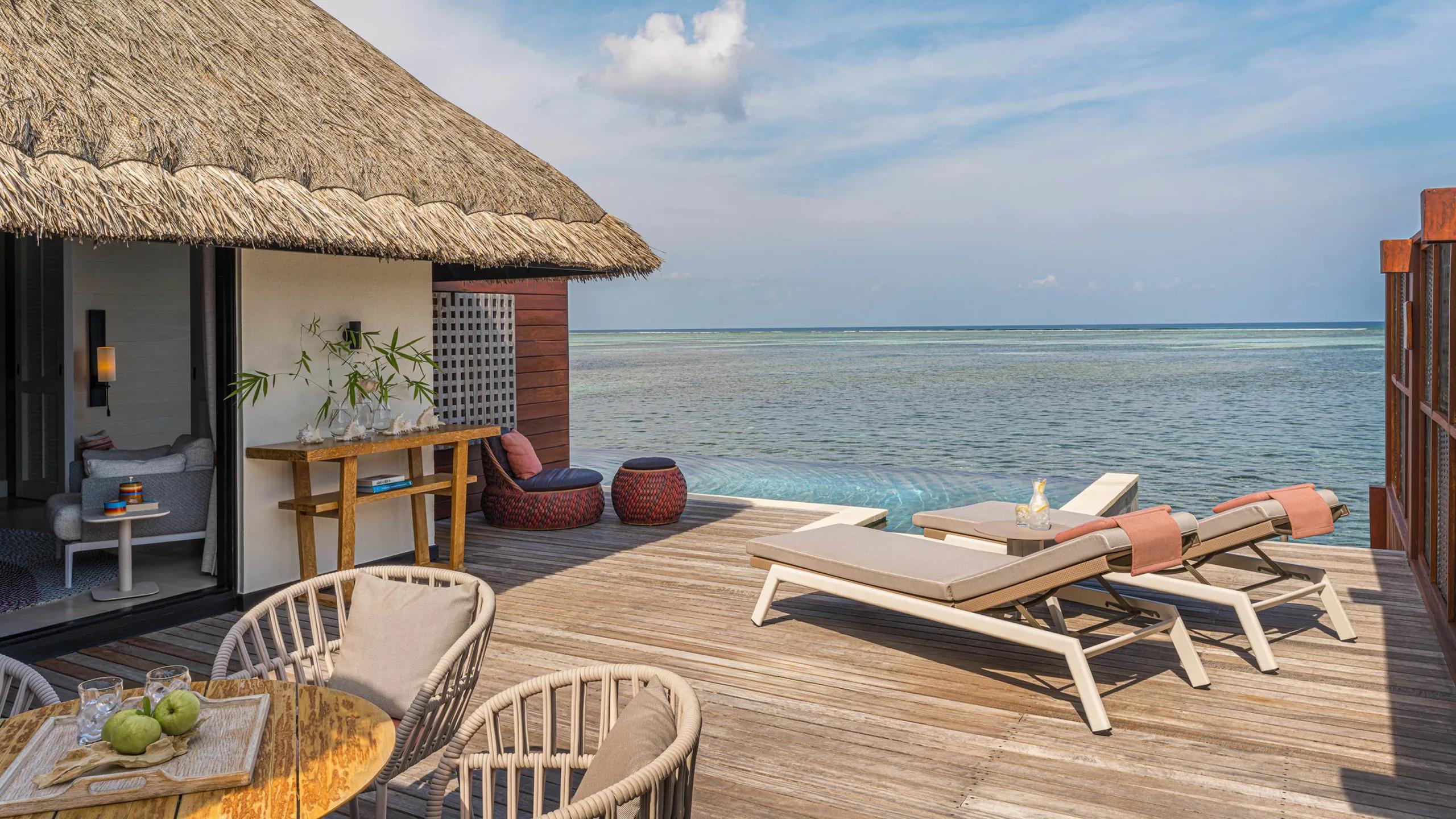 The Sunrise Family Water Villa's overwater deck and infinity-edge pool