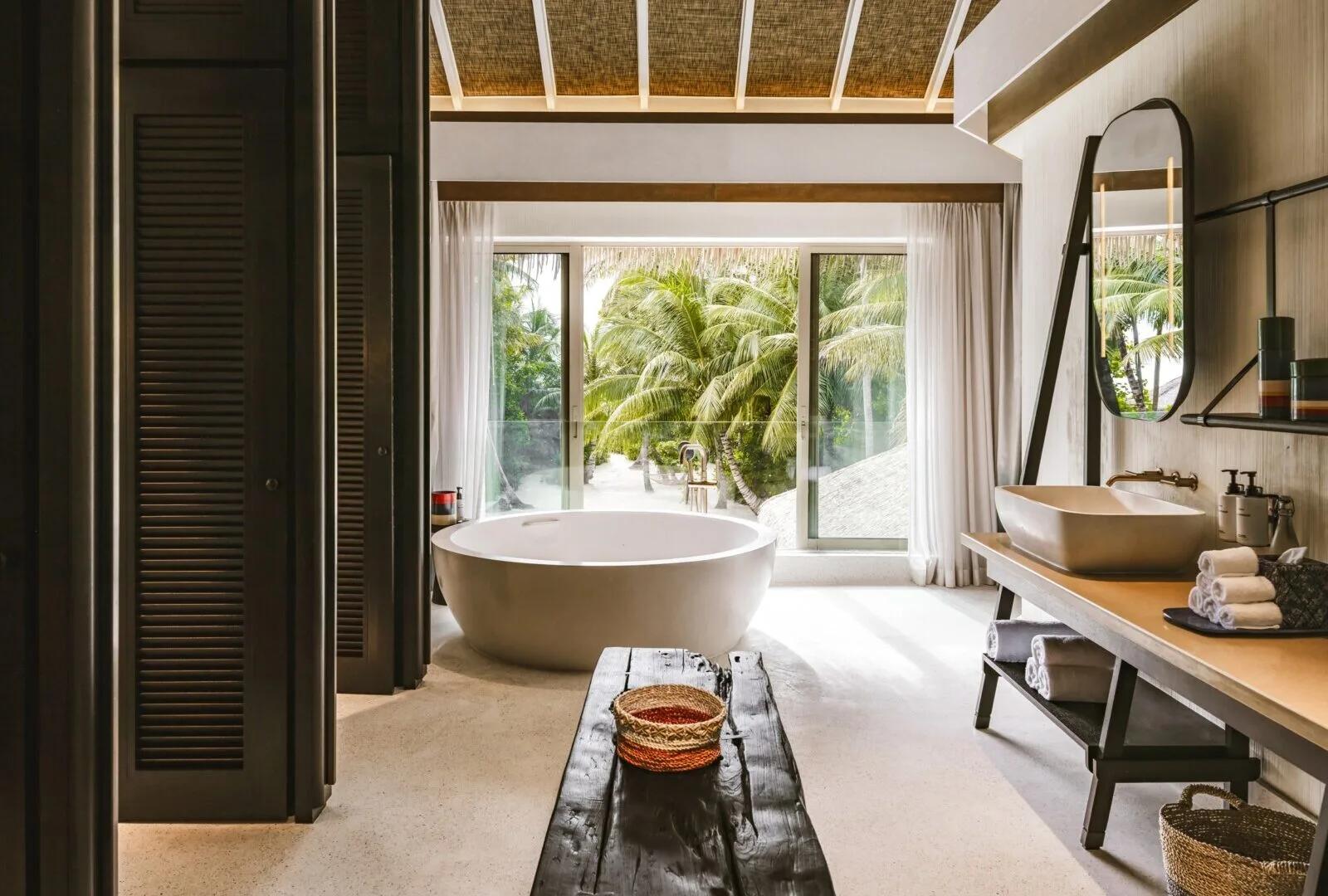 The two-storey Royal Beachfront Residence and its private pool, set among palms