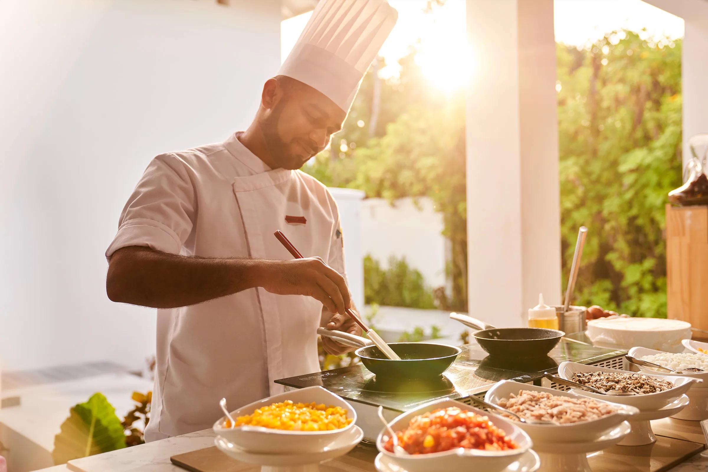 Live cooking underway at a Siyam World restaurant; a dedicated photograph of Del Mare, the resort's Italian beachfront restaurant, to follow