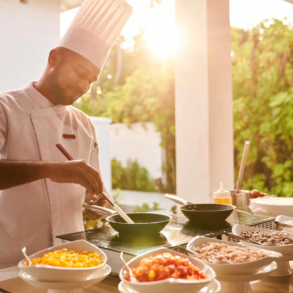 Live cooking underway at a Siyam World restaurant; a dedicated photograph of Del Mare, the resort's Italian beachfront restaurant, to follow