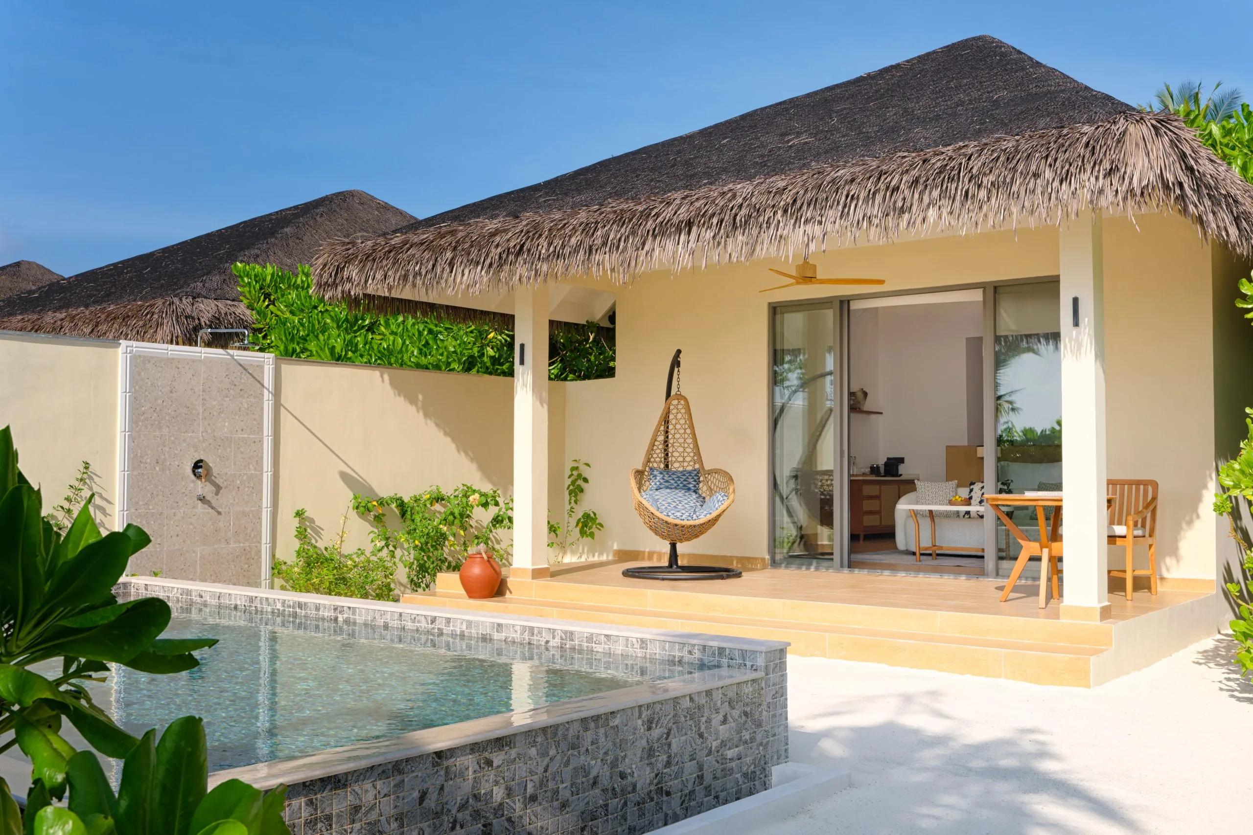 A Beach Pool Villa's bedroom, pool deck and private pool at dusitD2 Feydhoo Maldives