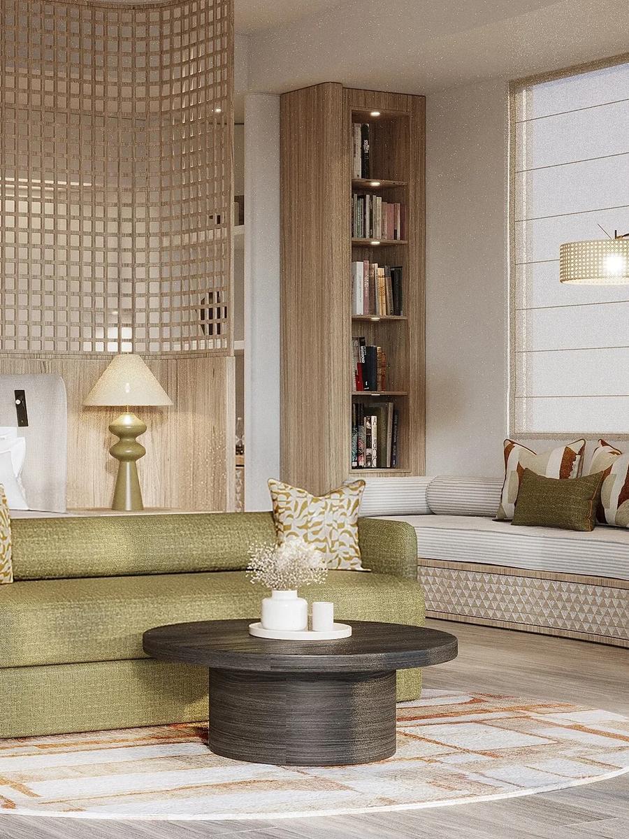 A bedroom lounge nook in a Three Bedroom Sunset Water Retreat, with a woven screen, bookshelf and daybed