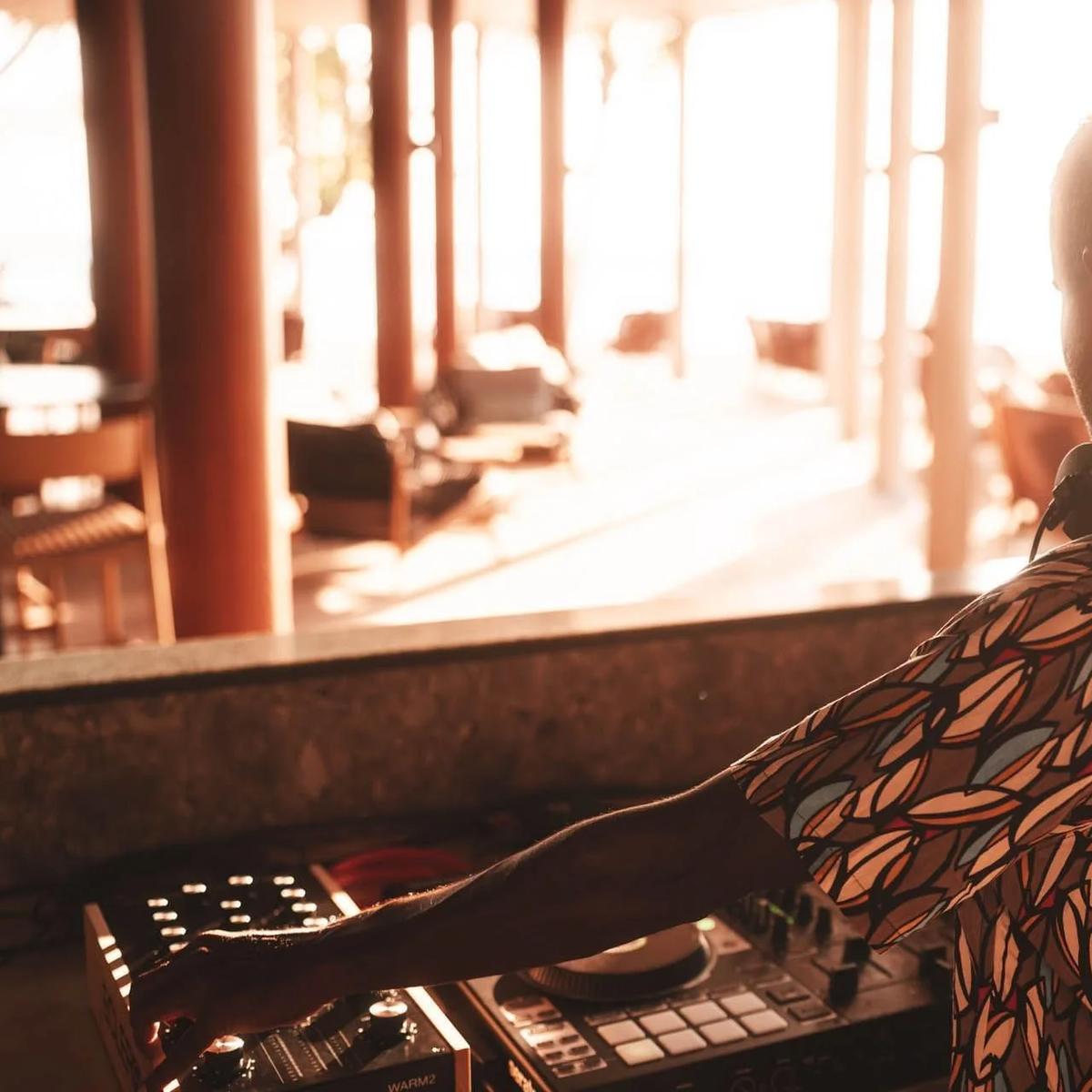 Sting Bar's resident DJ at sunset, ahead of the evening's live music