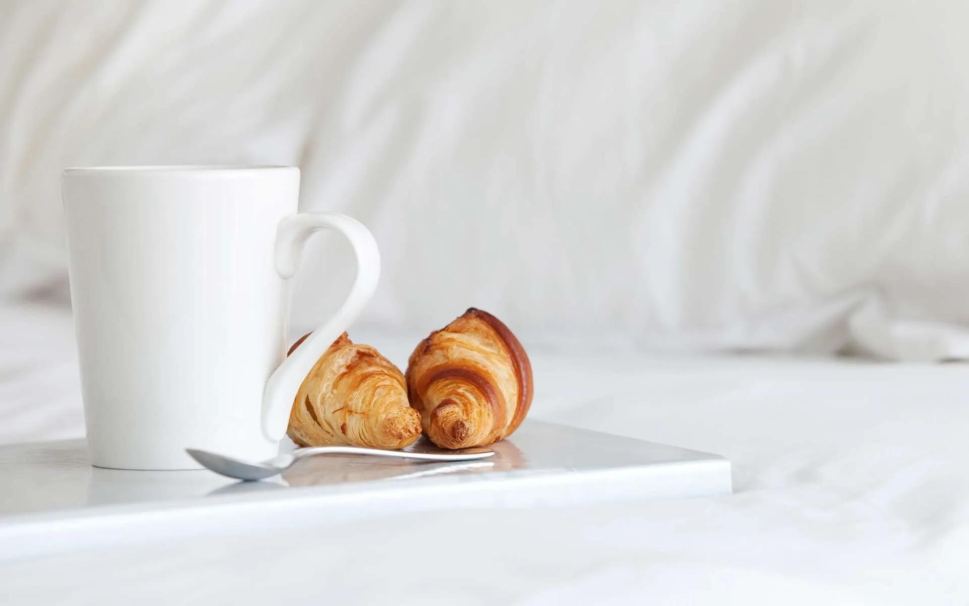 A tray of coffee and croissants served in-villa