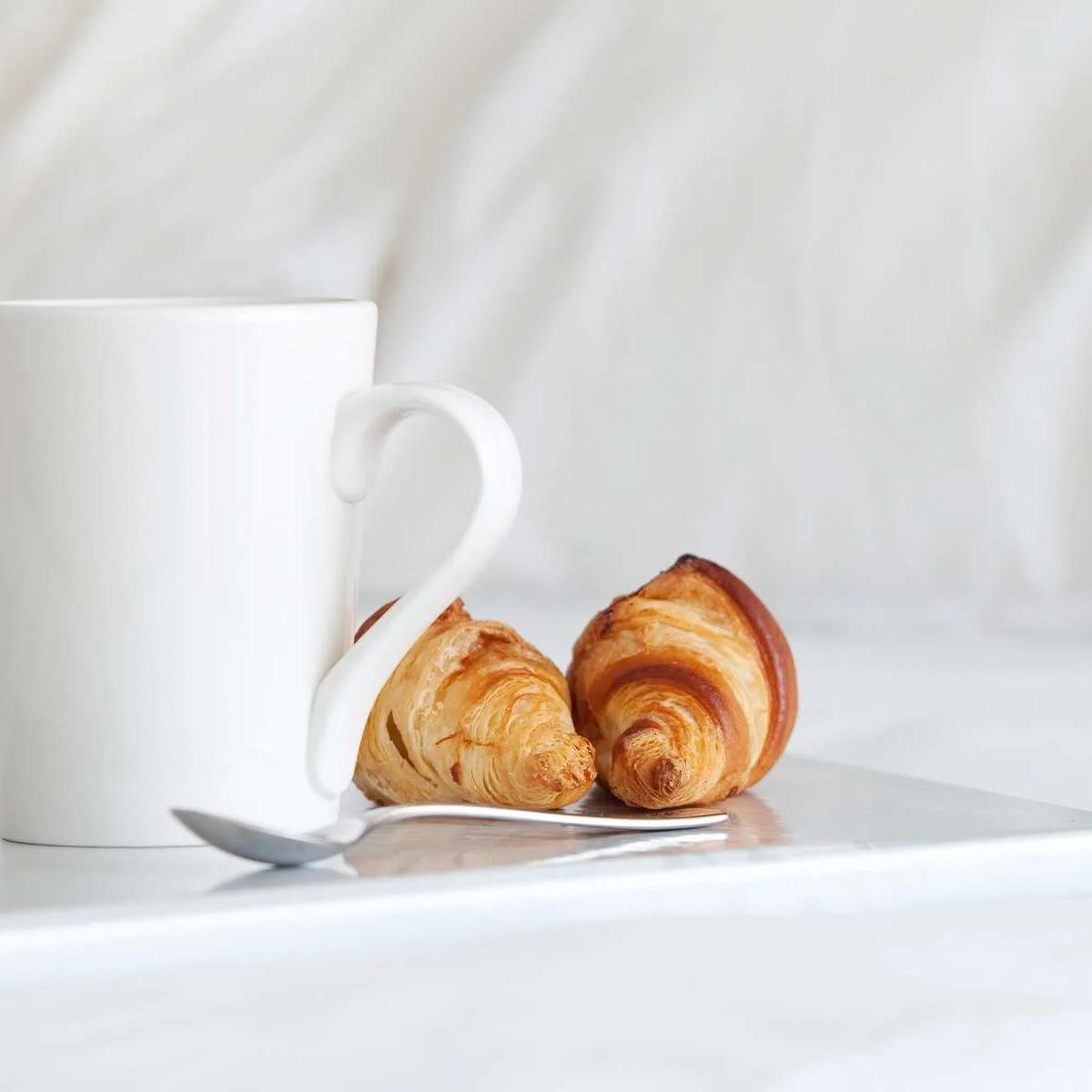 A tray of coffee and croissants served in-villa