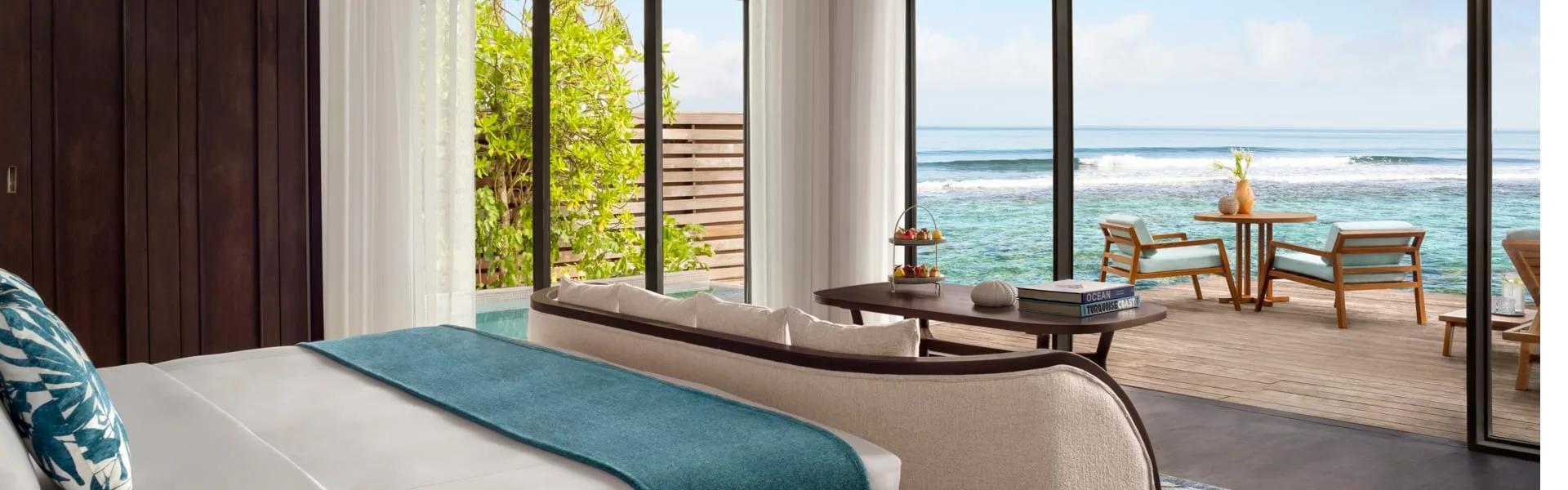 Ocean Pool Villa bedroom opening onto a private pool with uninterrupted ocean views