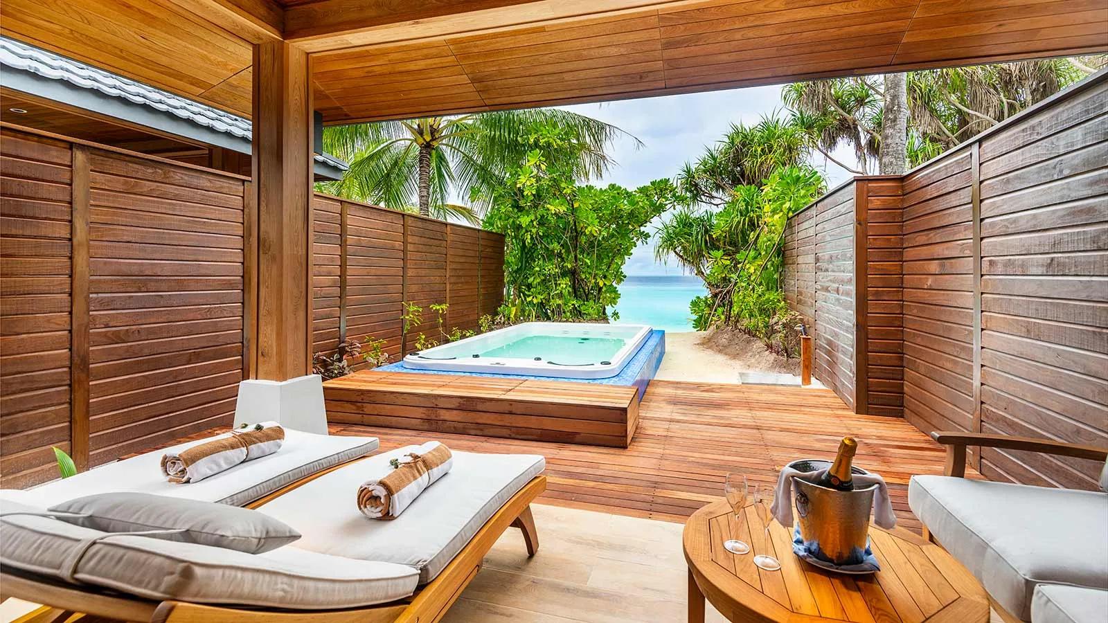 The exterior jacuzzi deck of a Beach Suite with Jacuzzi at Lily Beach Resort & Spa