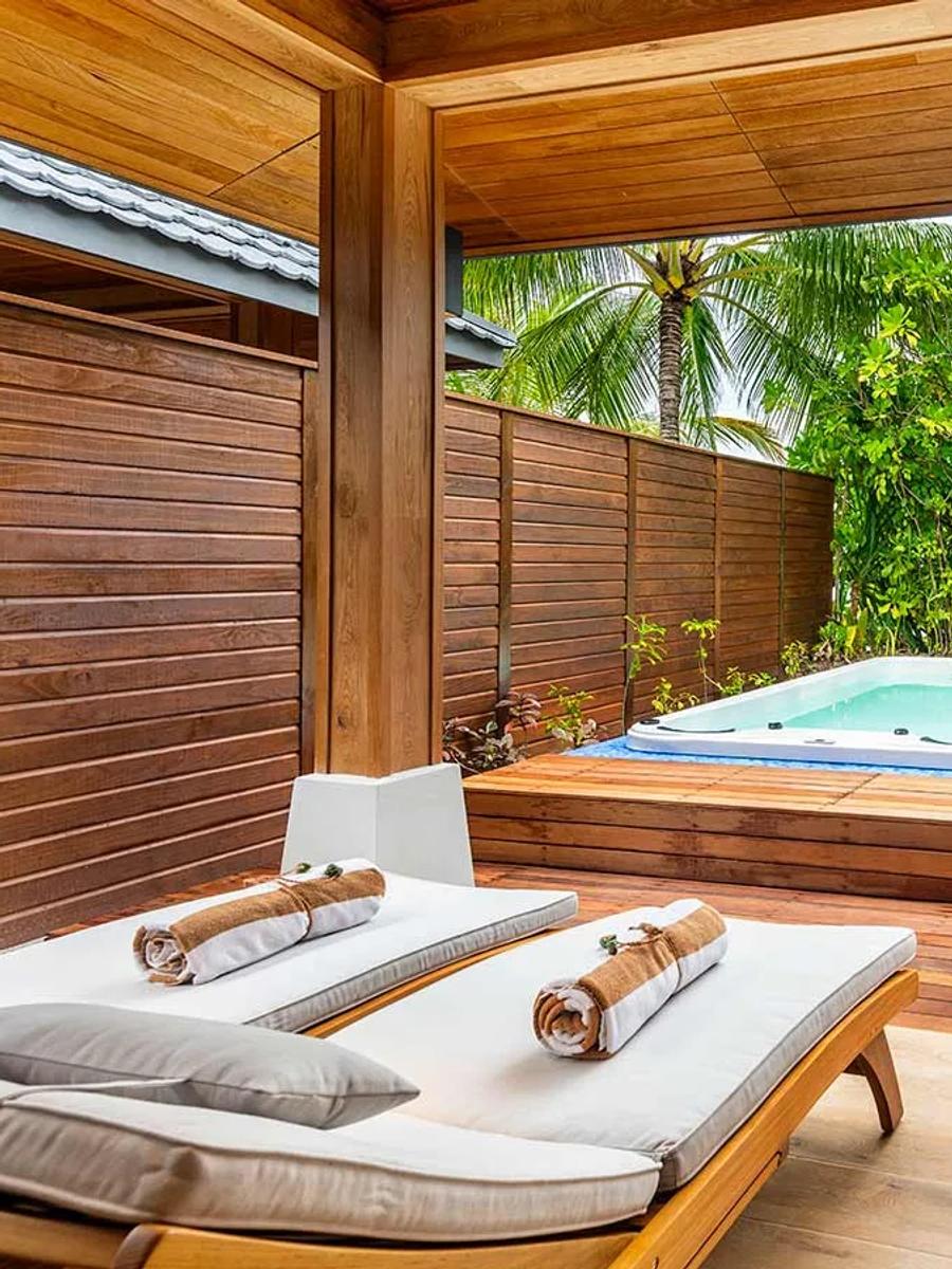 The exterior jacuzzi deck of a Beach Suite with Jacuzzi at Lily Beach Resort & Spa