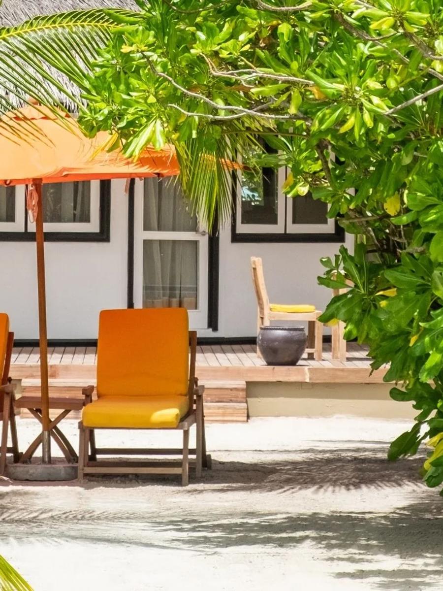 Exterior of a Beachfront Villa at Angsana Velavaru, its cajan-roofed hut set on the beach
