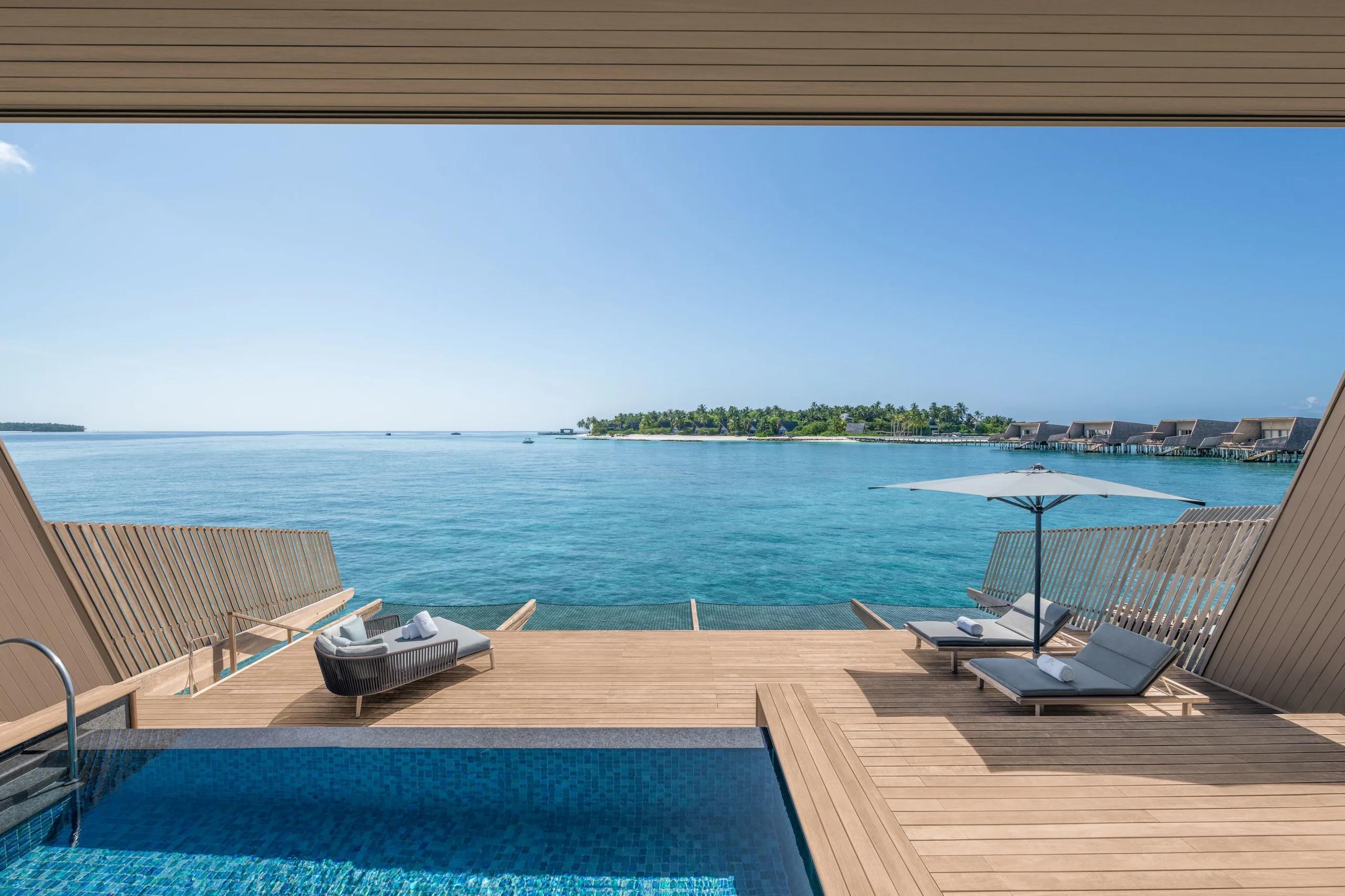An overwater villa terrace above the lagoon at The St. Regis Maldives Vommuli Resort — the Sunset Overwater Villa shares this overwater layout; a dedicated photograph is not yet available