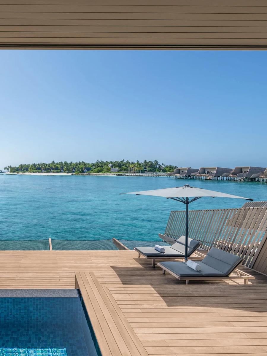 An overwater villa terrace above the lagoon at The St. Regis Maldives Vommuli Resort — the Sunset Overwater Villa shares this overwater layout; a dedicated photograph is not yet available