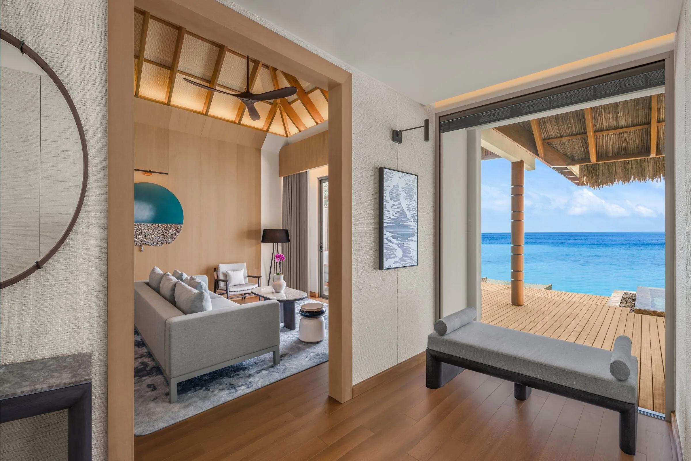 The living area of a two-bedroom overwater villa
