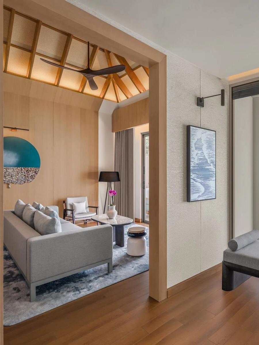 The living area of a two-bedroom overwater villa
